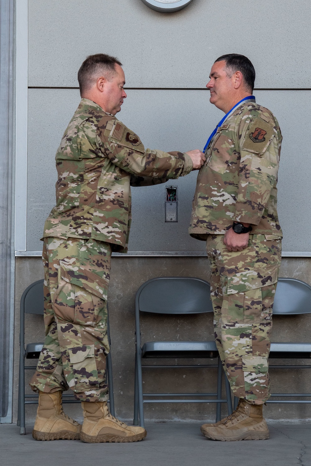 Col. Brian Gunderson, Nevada Air National Guard Director of Staff-Air awards the Maj. Gen. Drennan A. Clark Order of Nevada to Senior Master Sgt. Rommie Brown