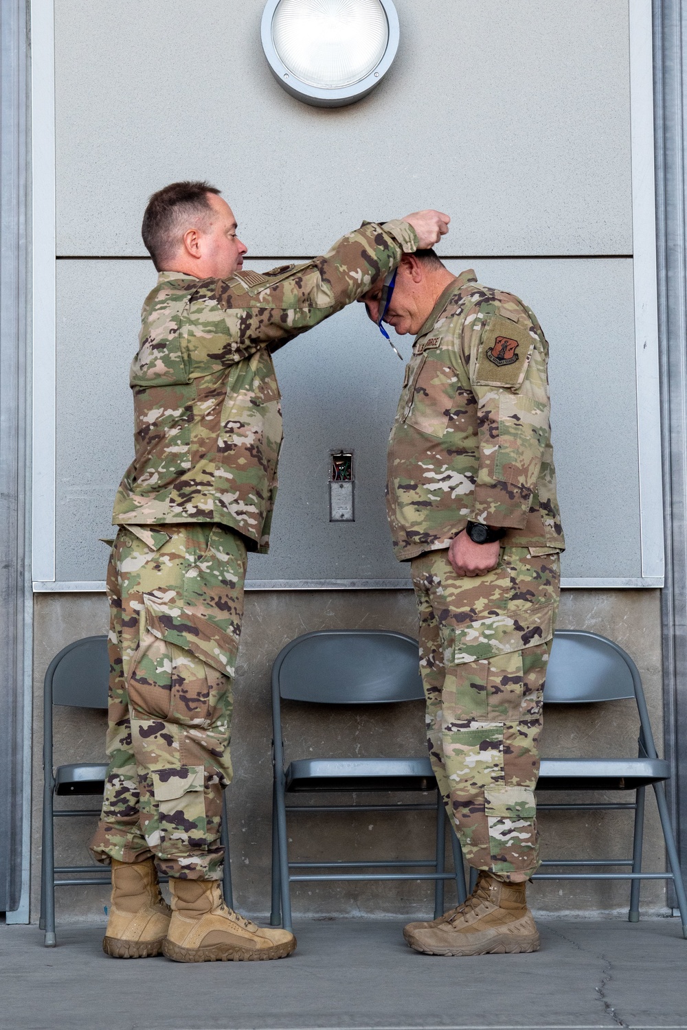 Col. Brian Gunderson, Nevada Air National Guard Director of Staff-Air awards the Maj. Gen. Drennan A. Clark Order of Nevada to Senior Master Sgt. Rommie Brown