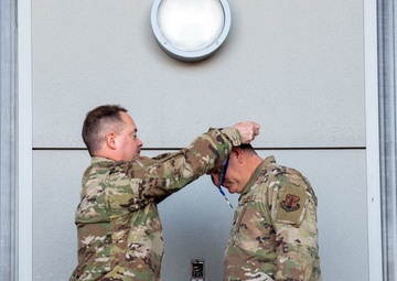 Col. Brian Gunderson, Nevada Air National Guard Director of Staff-Air awards the Maj. Gen. Drennan A. Clark Order of Nevada to Senior Master Sgt. Rommie Brown