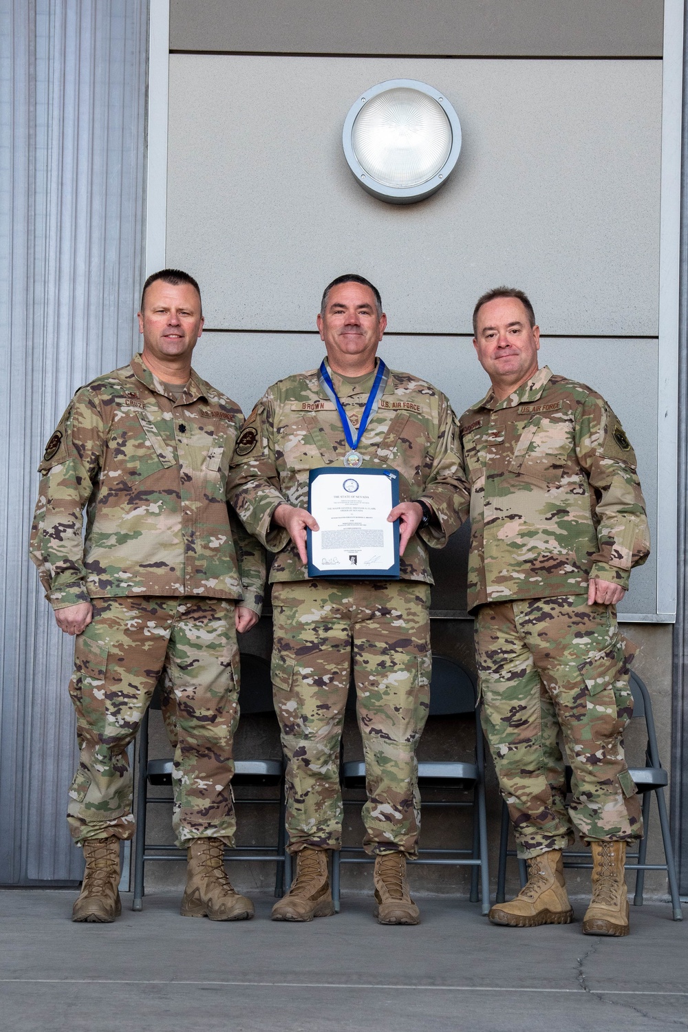 Lt. Col. Shaun Cruze, commander 152nd Logistics Readiness Squadron, Senior Master Sgt. Rommie Brown and Col. Brian Gunderson, Nevada Air National Guard Director of Staff-Air pose after Brown was awarded the Maj. Gen. Drennan A. Clark Order of Nevada Medal