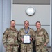 Lt. Col. Shaun Cruze, commander 152nd Logistics Readiness Squadron, Senior Master Sgt. Rommie Brown and Col. Brian Gunderson, Nevada Air National Guard Director of Staff-Air pose after Brown was awarded the Maj. Gen. Drennan A. Clark Order of Nevada Medal