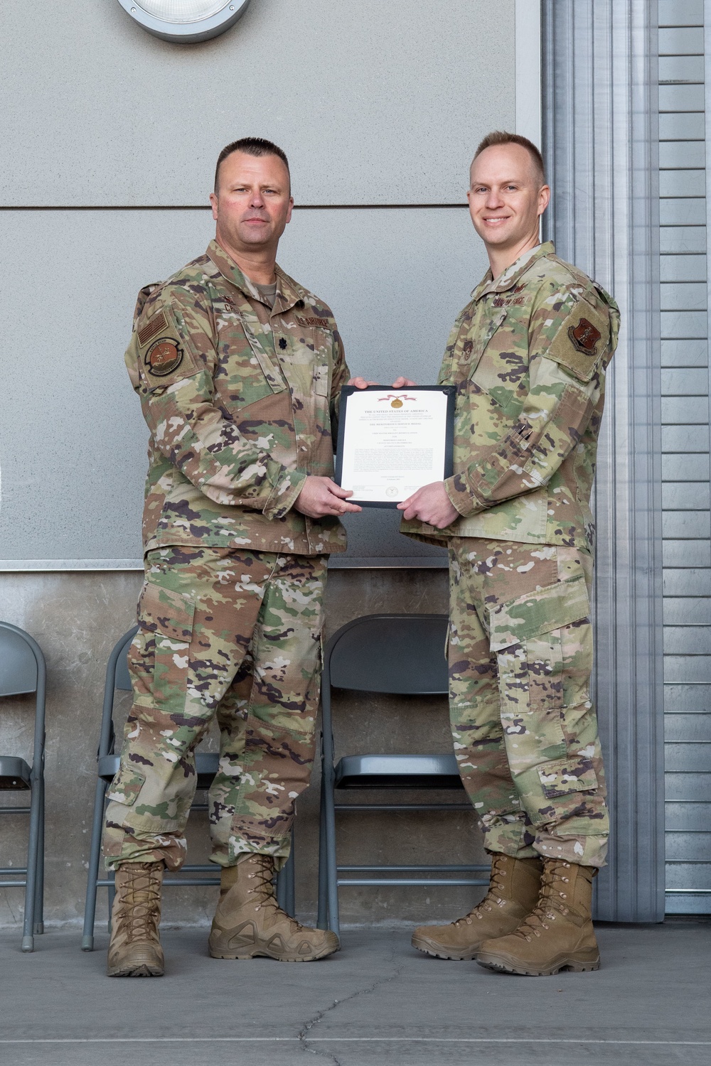 Lt. Col. Shaun Cruze, commander 152nd Logistics Readiness Squadron presents the Meritorius Service Medal first oak leaf cluster to Chief Master Sgt. Jeffrey Linton, Command Chief, 152nd Airlift Wing