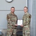 Lt. Col. Shaun Cruze, commander 152nd Logistics Readiness Squadron presents the Meritorius Service Medal first oak leaf cluster to Chief Master Sgt. Jeffrey Linton, Command Chief, 152nd Airlift Wing