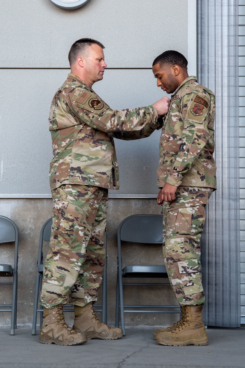 Lt. Col. Shaun Cruze, commander 152nd Logistics Readiness Squadron presents the Air Force Commendation Medal to Senior Airman Kevin Davis