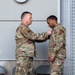 Lt. Col. Shaun Cruze, commander 152nd Logistics Readiness Squadron presents the Air Force Commendation Medal to Senior Airman Kevin Davis