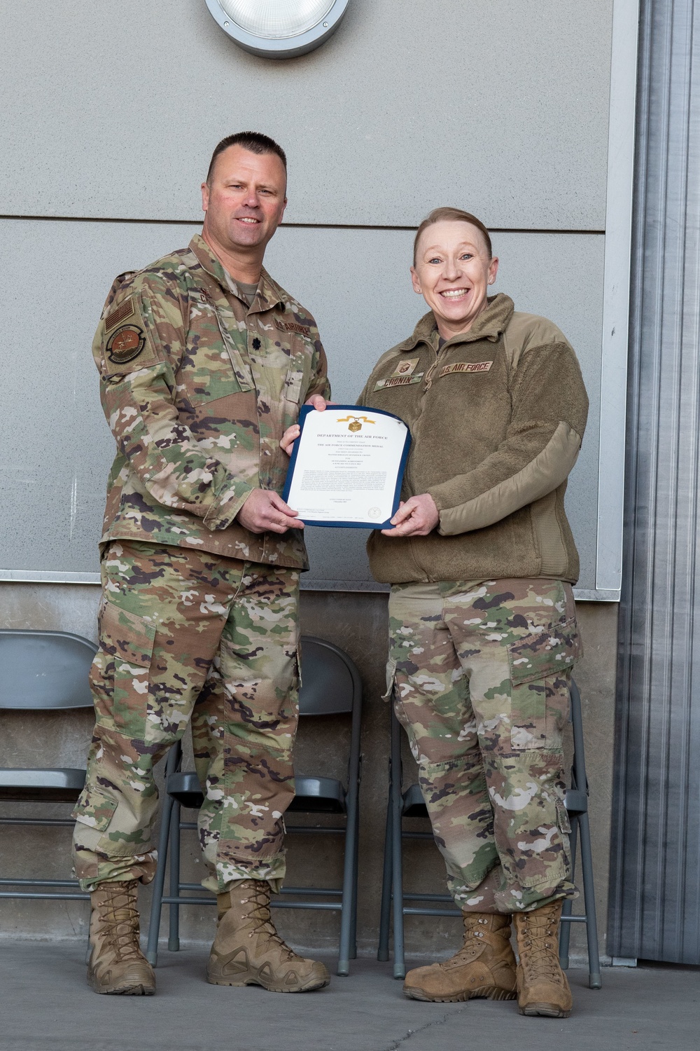 Lt. Col. Shaun Cruze, commander 152nd Logistics Readiness Squadron presents the Air Force Commendation Medal first oak leaf cluster to Master Sgt. Jennifer Cronin