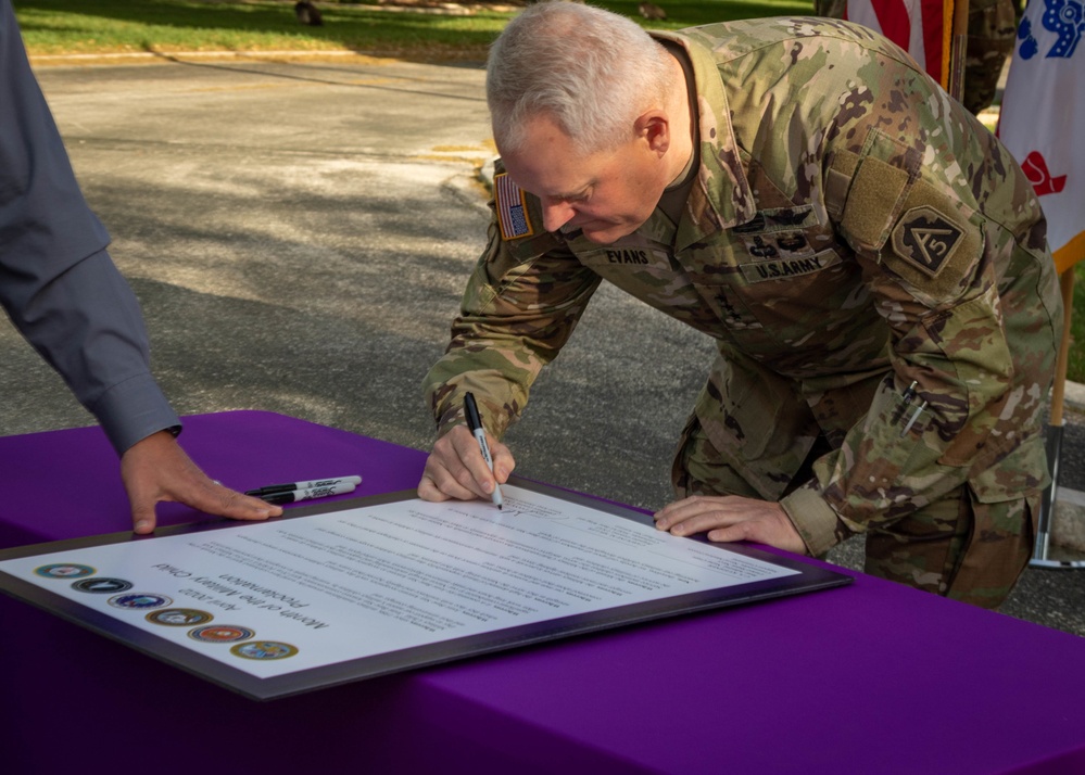 Leadership of JBSA sign the proclamation of Month of the Military Child