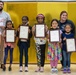 Artists in Training: School Age Care personnel awards winners of school art contest