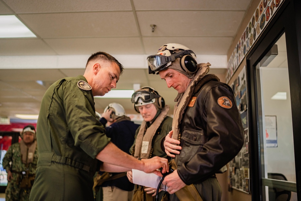 Distinguished Visitors depart to USS Tripoli