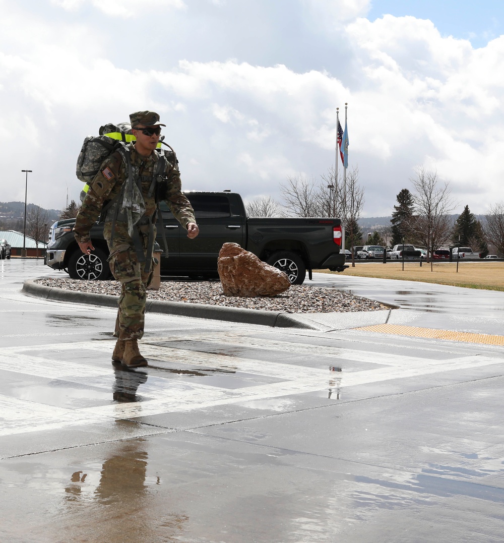 Soldiers from the 129th MPAD complete ruck march for the Keith L. Ware Award requirement