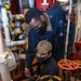 Gas Turbine Systems Technician 3rd Class Demario Spencer, top, from Monroe, La., instructs Fireman Coby Francis, bottom, from Vancouver, Wash., on proper nozzleman techniques during a firefighting drill