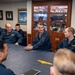 Rear Adm. Curt Renshaw, commander Carrier Strike Group (CSG) 8, addresses the wardroom assigned to USS Mitscher (DDG 57)