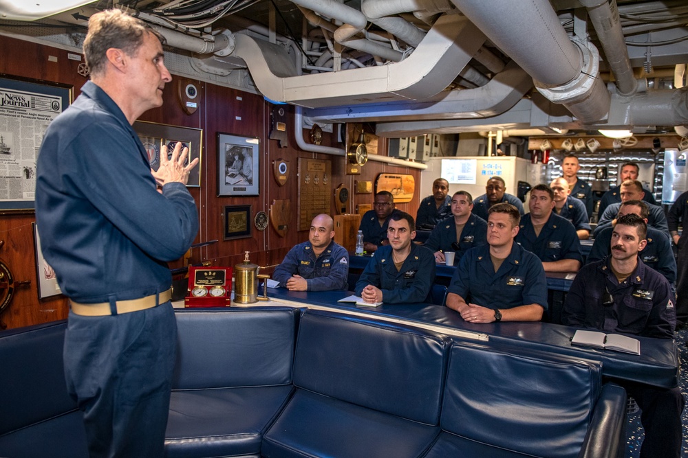 Rear Adm. Curt Renshaw, commander Carrier Strike Group (CSG) 8, addresses the chief’s mess aboard USS Mitscher (DDG 57)