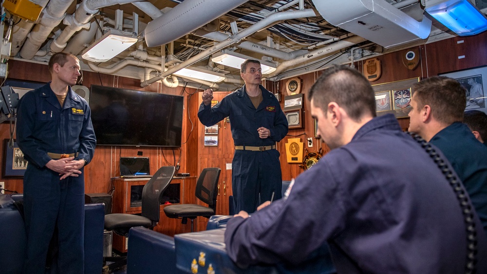 Rear Adm. Curt Renshaw, commander of Carrier Strike Group (CSG) 8, and Capt. Todd Zenner, commander of Destroyer Squadron (DESRON) 28, address the chief’s mess aboard USS Mitscher (DDG 57)