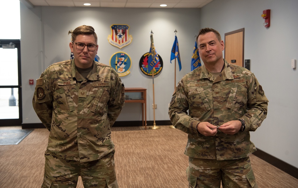 110th Wing Tech. Sgt. Jacob Rader receives command coin