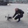 Emergency response team member checks drone before deploying