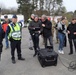 Emergency response teams gather to watch drone footage