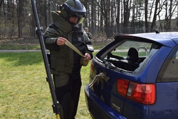 Belgian bomb squad member attempts to open suspect car in exercise