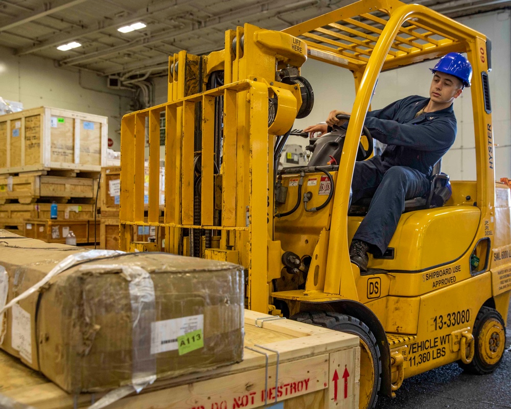 GHWB Sailor Operates Forklift