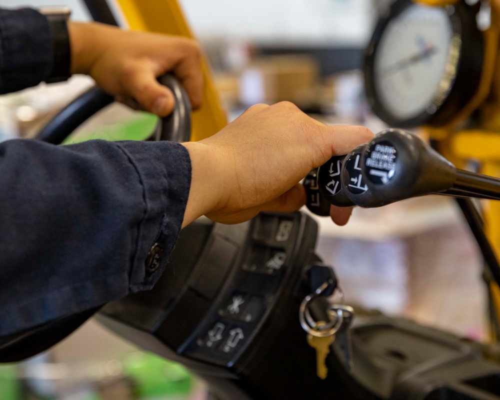 GHWB Sailor Operates Forklift