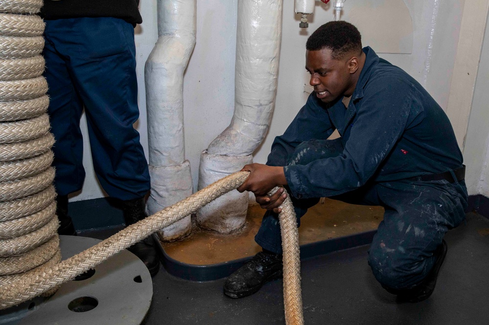 Sailors Stow Mooring Lines