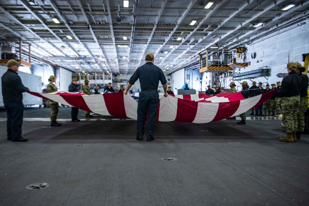 Sailors Fold A Ceremonial Flag