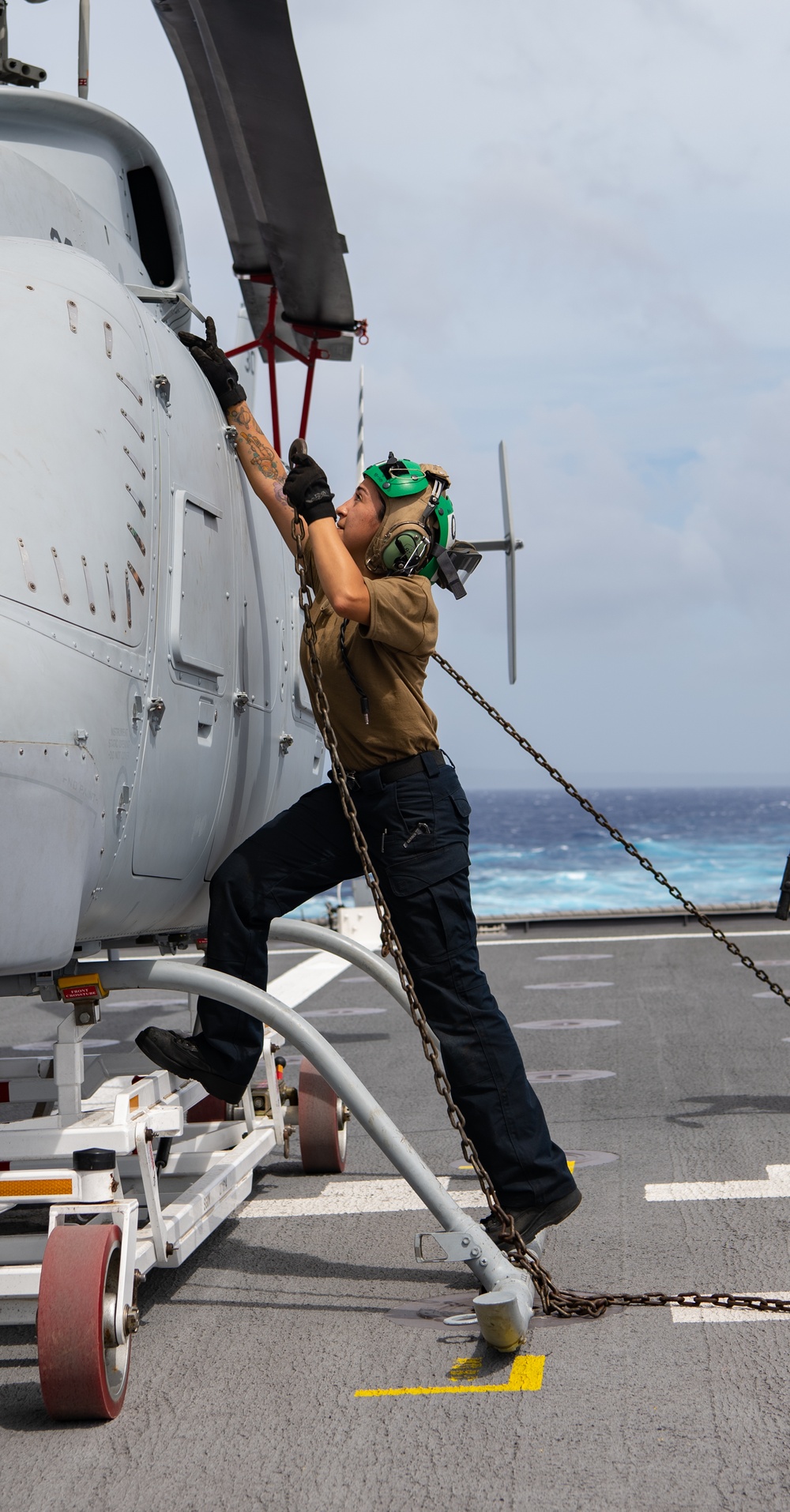 HSC 23 Sailor Chains Down MQ-8C Fire Scout