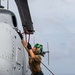 HSC 23 Sailor Chains Down MQ-8C Fire Scout