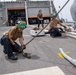 HSC 23 Sailor Chains Down on MQ-8C Fire Scout