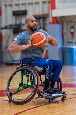 Retired U.S. Army Spc Brent Garlic Throws a basketball