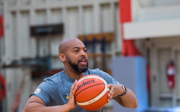 Retired U.S. Army Spc Brent Garlic Throws a basketball