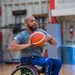 Retired U.S. Army Spc Brent Garlic Throws a basketball
