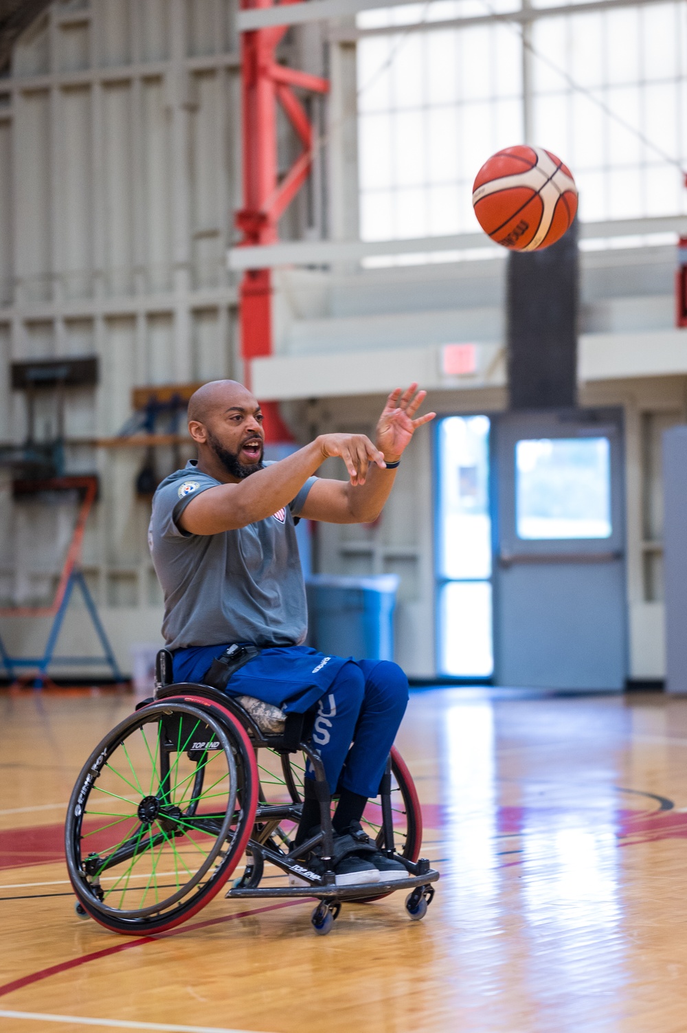 Retired U.S. Army Spc Brent Garlic Throws a basketball