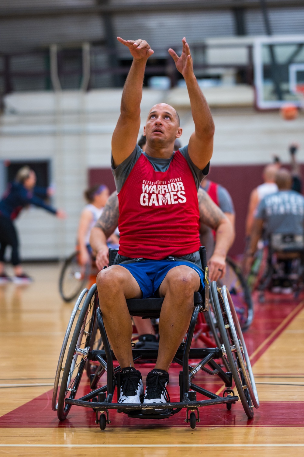 Retired U.S. Army Master Sgt. Earl Ohlinger shoots a basketball