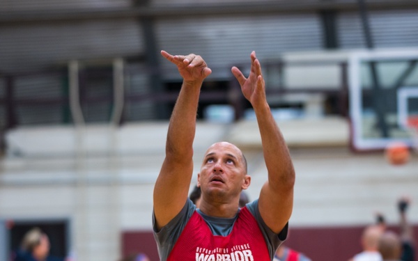 Retired U.S. Army Master Sgt. Earl Ohlinger shoots a basketball