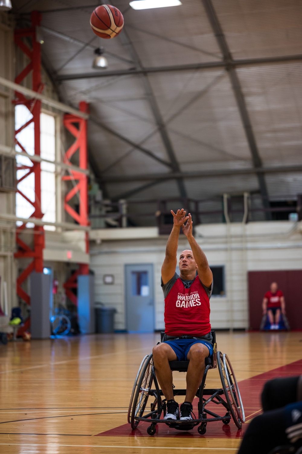 Retired U.S. Army Master Sgt. Earl Ohlinger shoots a basketball