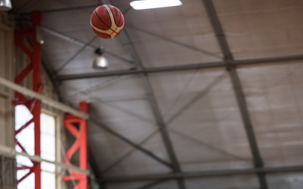 Retired U.S. Army Master Sgt. Earl Ohlinger shoots a basketball