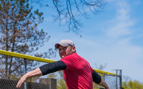 Retired Sergeant 1st Class Josh Olson throwing a discus