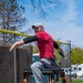 Retired Sergeant 1st Class Josh Olson throwing a discus