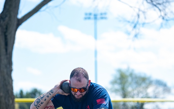 Retired U.S. Army Staff Sgt Ross Alewine throws a shot putt