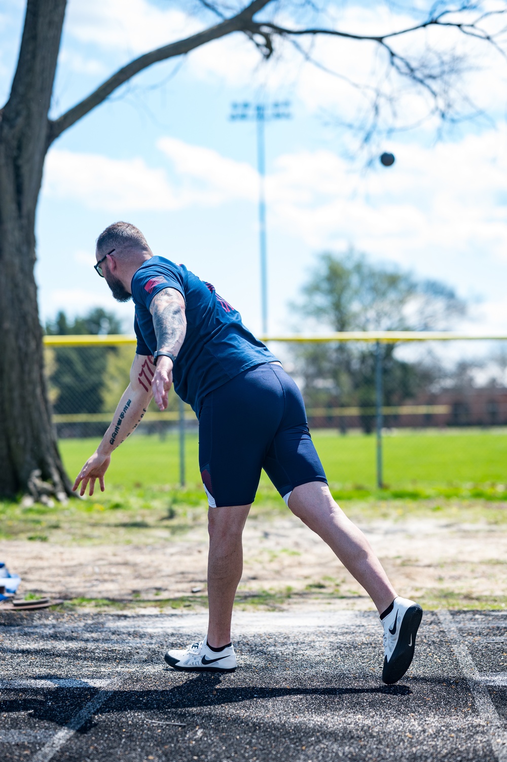 Retired U.S. Army Staff Sgt Ross Alewine throws a shot putt