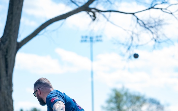 Retired U.S. Army Staff Sgt Ross Alewine throws a shot putt