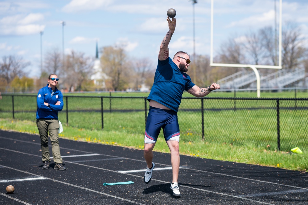 Retired U.S. Army Staff Sgt Ross Alewine throws a shot putt