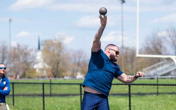 Retired U.S. Army Staff Sgt Ross Alewine throws a shot putt