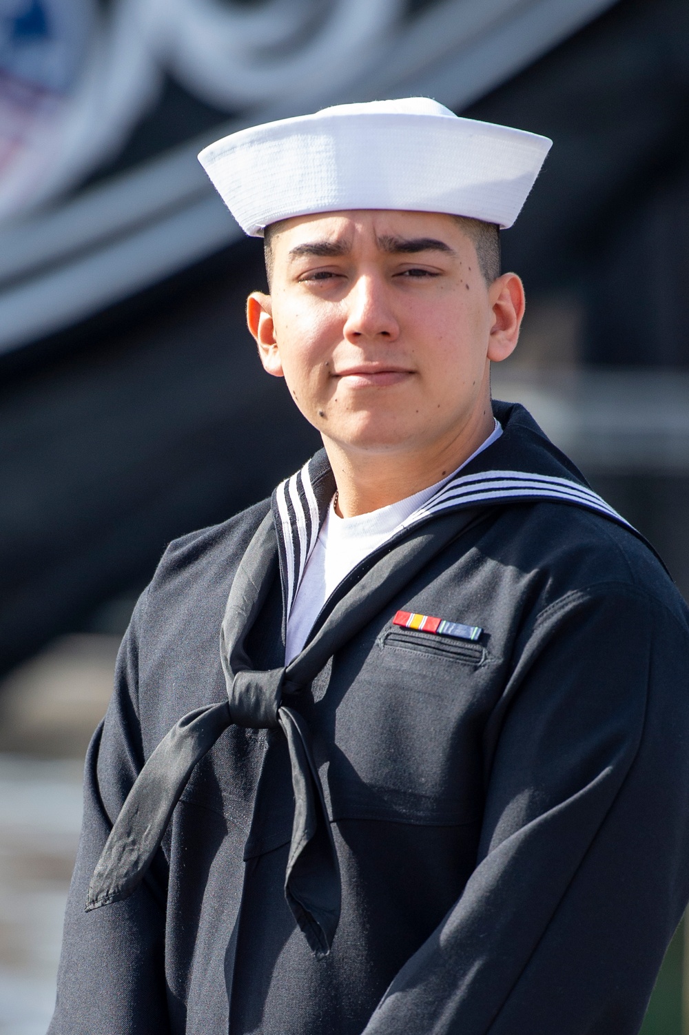 Seaman Christian Cerda, poses for a photo onboard the ship