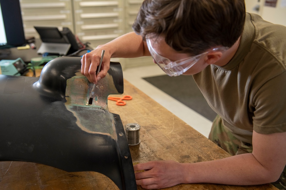 Maintenance repairs first CV-22 Osprey heat blanket