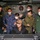 Abraham Lincoln Sailors and JMSDF military leaders observe a sonar module