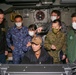 Abraham Lincoln Sailors and JMSDF military leaders observe a sonar module
