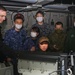 Abraham Lincoln Sailors and JMSDF military leaders observe a sonar module