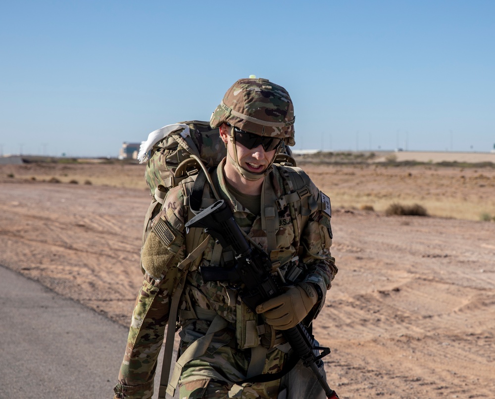 Soldiers ruck march 15 miles in the Regional Health Command-Central Best Leader Competition